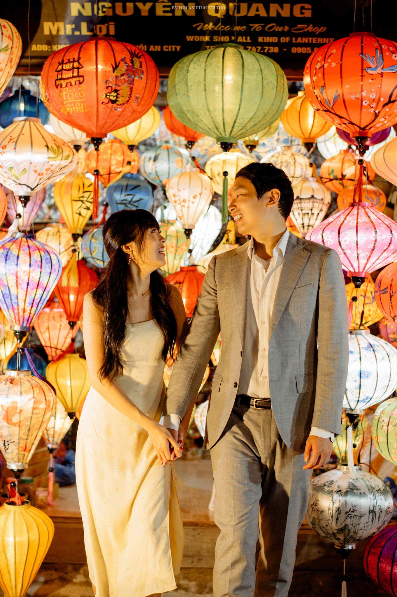 A couple surrounded by glowing lanterns in Hoi An, one of Vietnam’s most romantic spots.