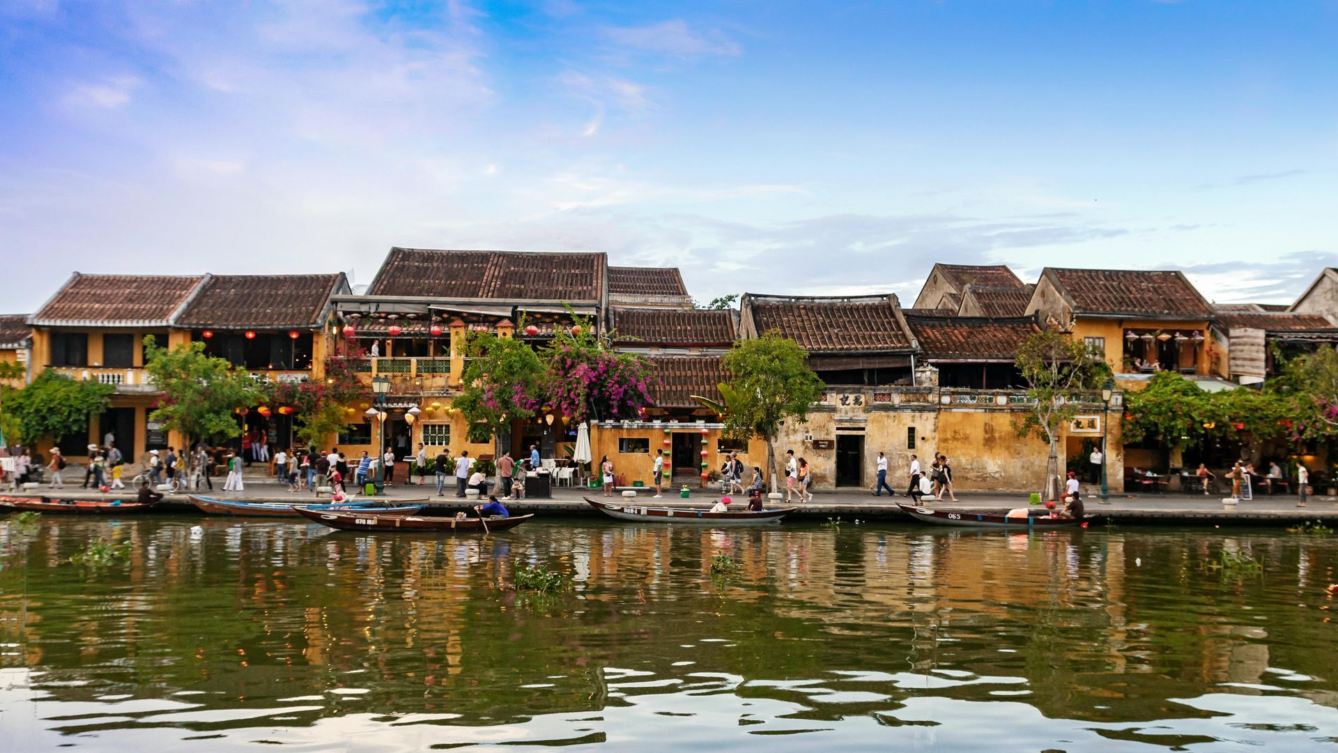 The ancient town of Hoi An in the morning, serene and peaceful with old houses bathed in soft sunlight.