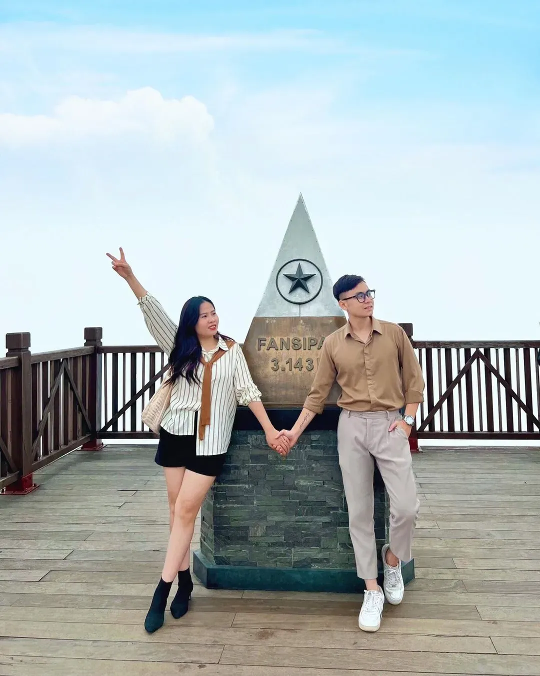 A couple celebrating love at Fansipan Peak, the highest mountain in Vietnam and a must-visit for adventurous pairs.
