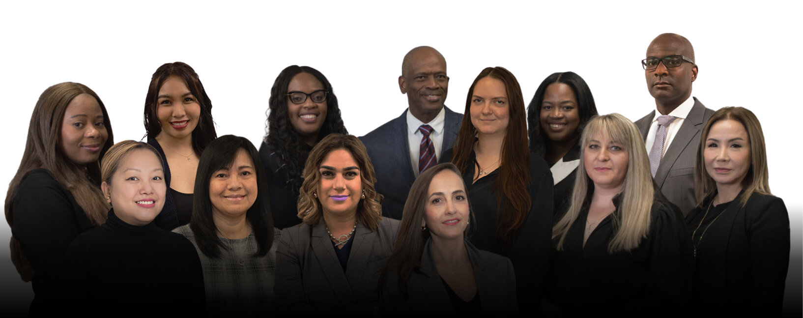 Professional group portrait of thirteen individuals in business attire smiling against a plain white background.