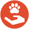 White paw over hand icon on an orange circle, symbolizing pet care or support