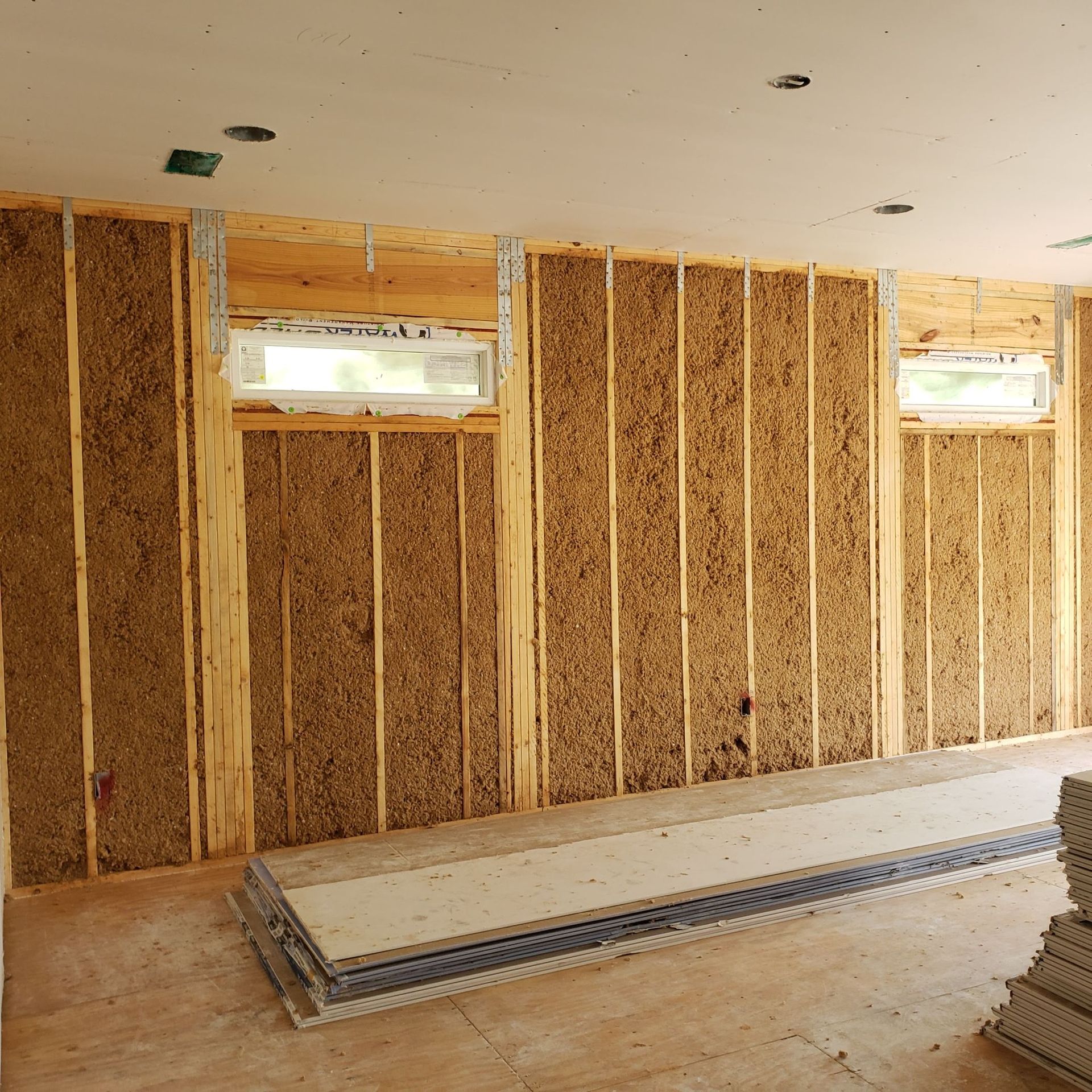 A room with a lot of wooden walls and a window