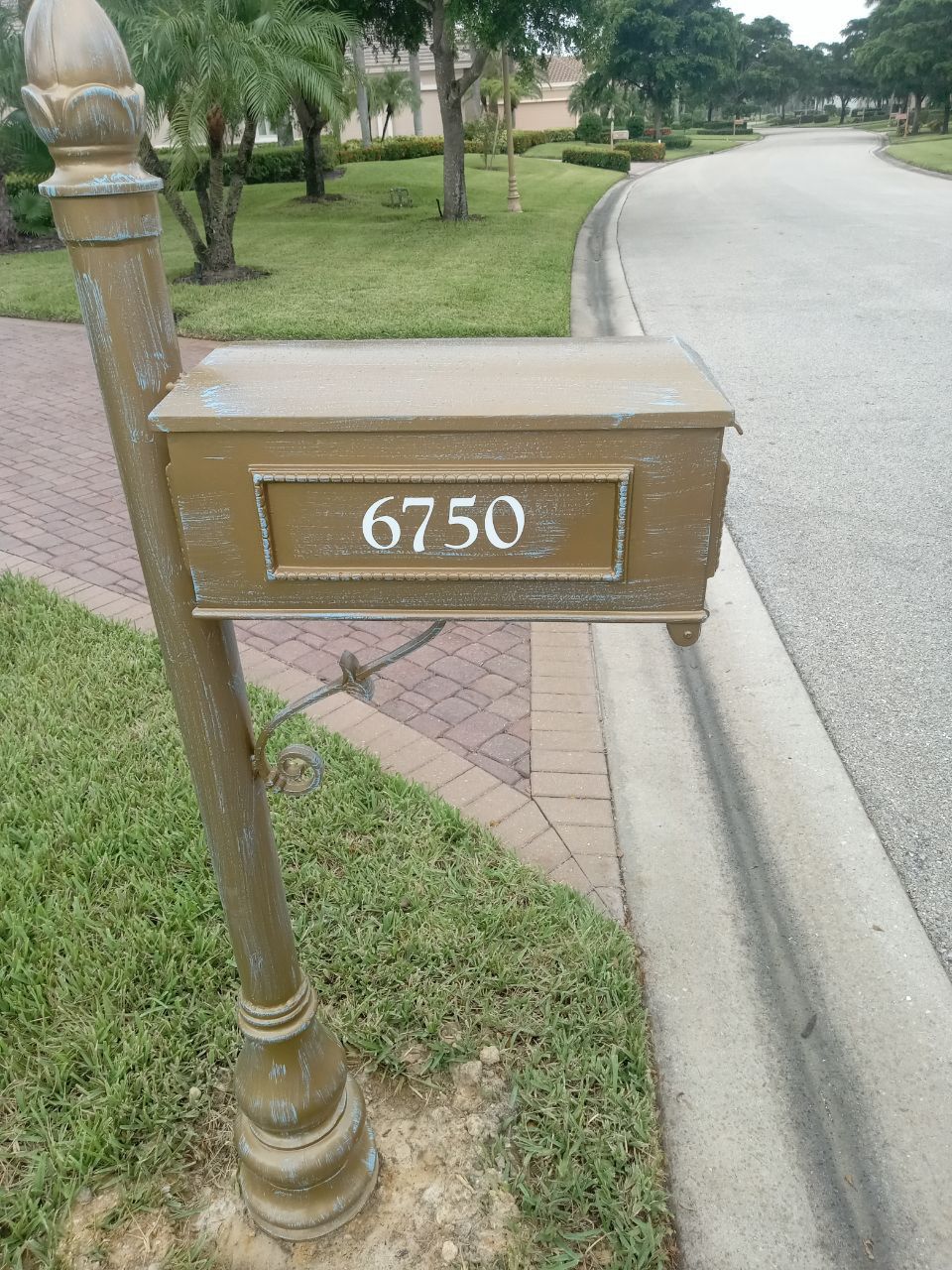 A mailbox has the address of 6750 on it
