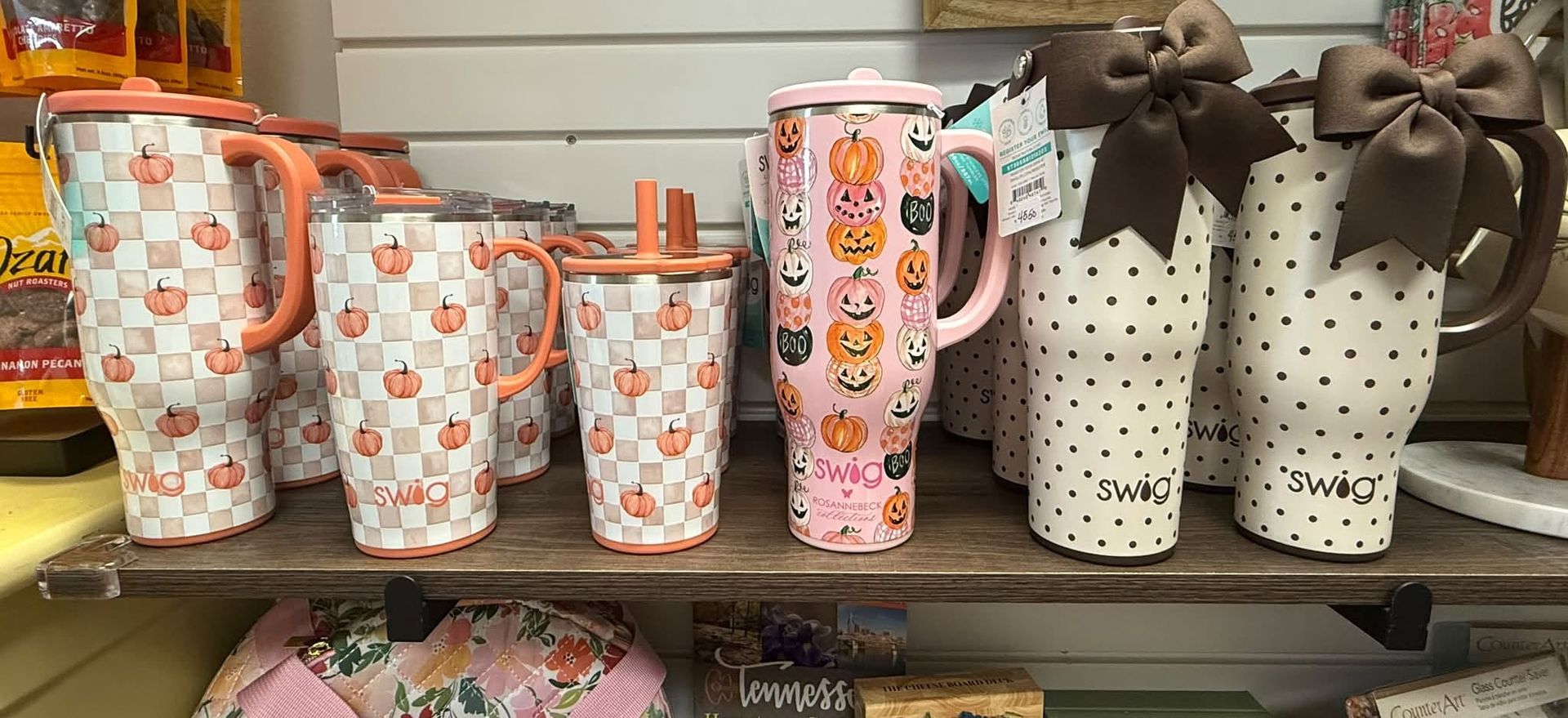 Blue insulated tumbler with white chickens and flowers pattern, brand logo near the bottom