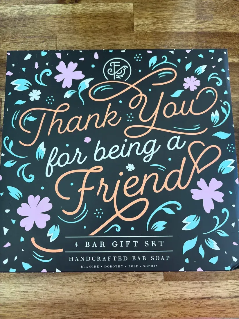Thank-you gift set box with floral accents and script reading “Thank You for being a Friend”