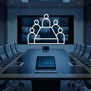 A conference room with a long table and chairs and a large screen on the wall.