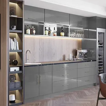 A kitchen with gray cabinets , stainless steel appliances , a wine cooler and a sink.