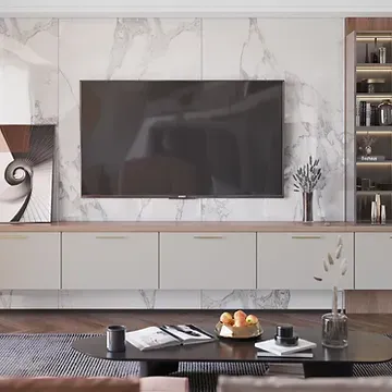 A living room with a flat screen tv hanging on the wall.