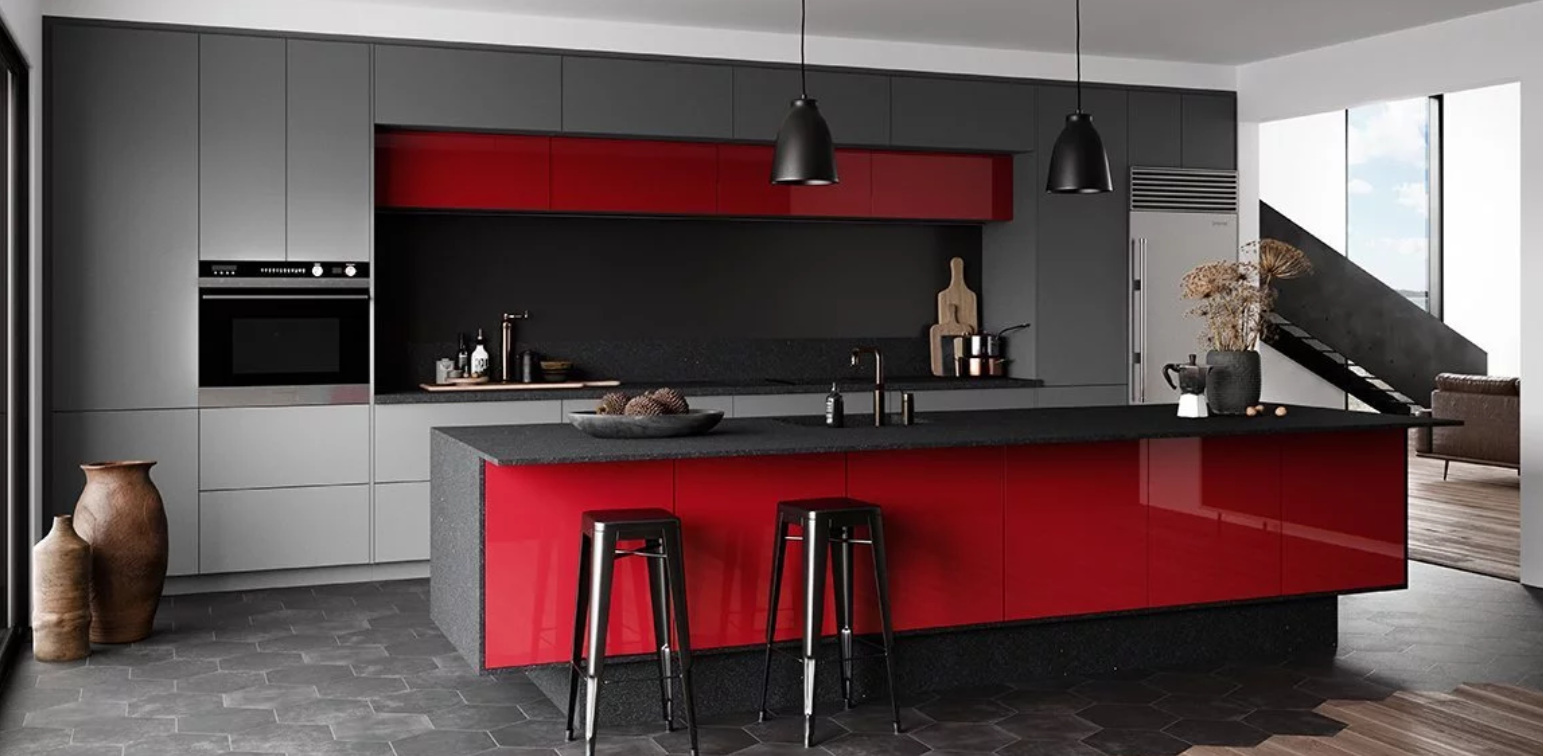A kitchen with gray cabinets and a red island