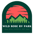 Logo for Wild Rose RV Park in Kalispell, MT. Features mountains, sunset, and trees in a green and red color scheme.