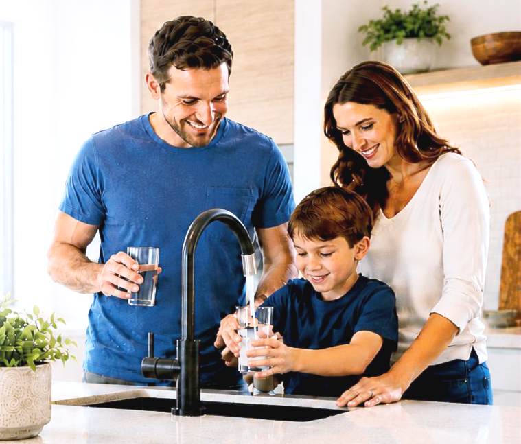 family with child getting clean tap water