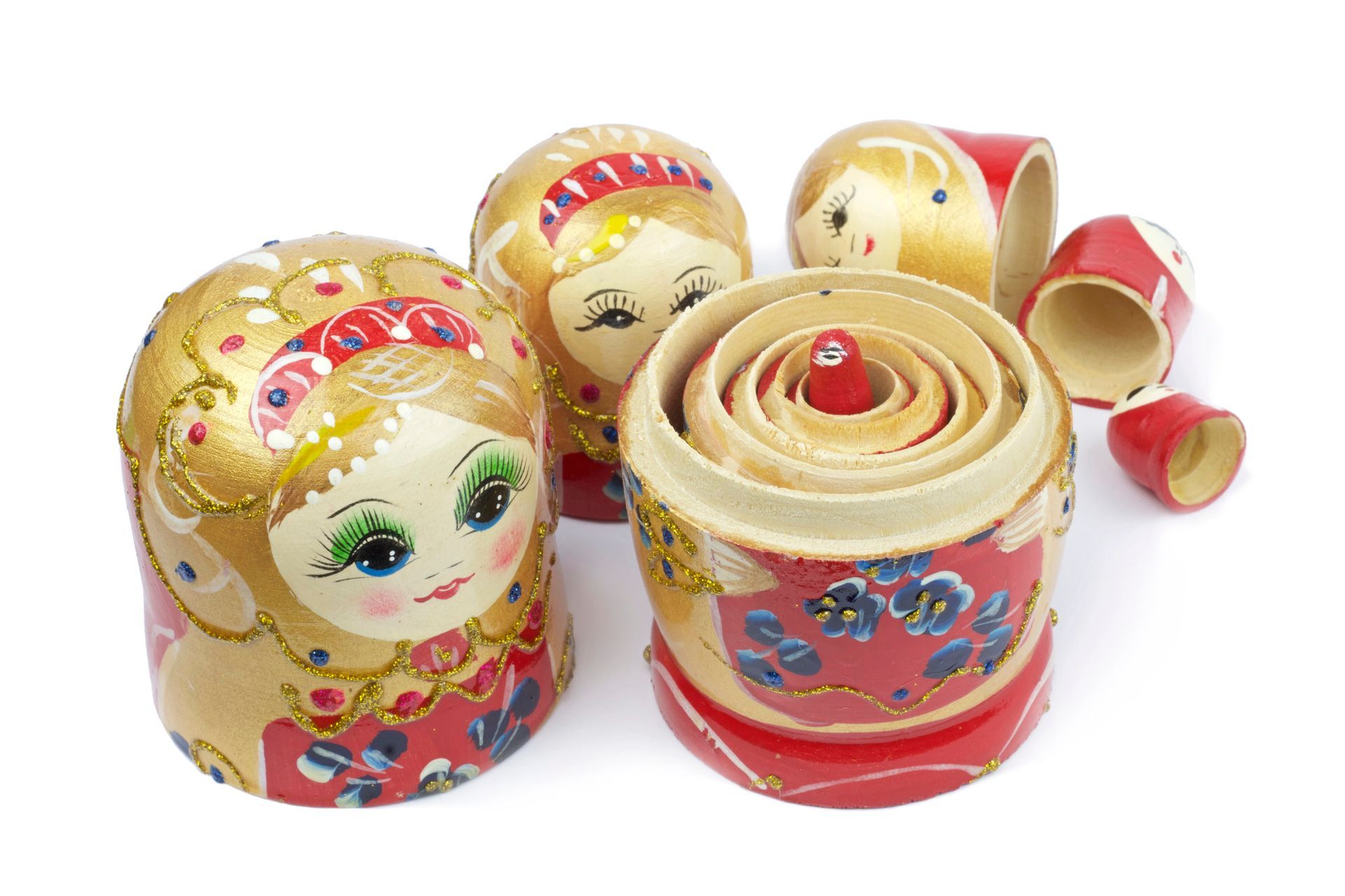 Nested Russian Matryoshka dolls, brightly painted with floral and face designs.