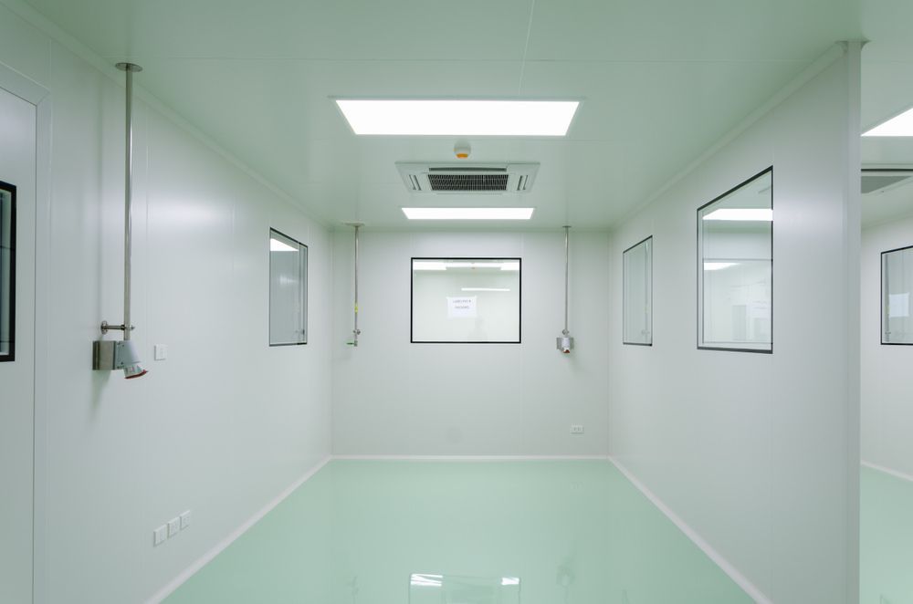 A Clean Room With White Walls and a Green Floor — Twin Cities Glass In Albury, NSW