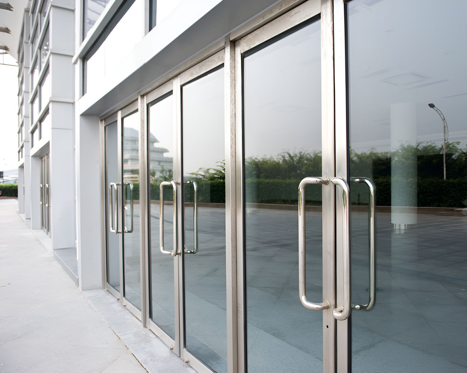 A Building With a Lot of Glass Doors and Handles — Twin Cities Glass In Albury, NSW
