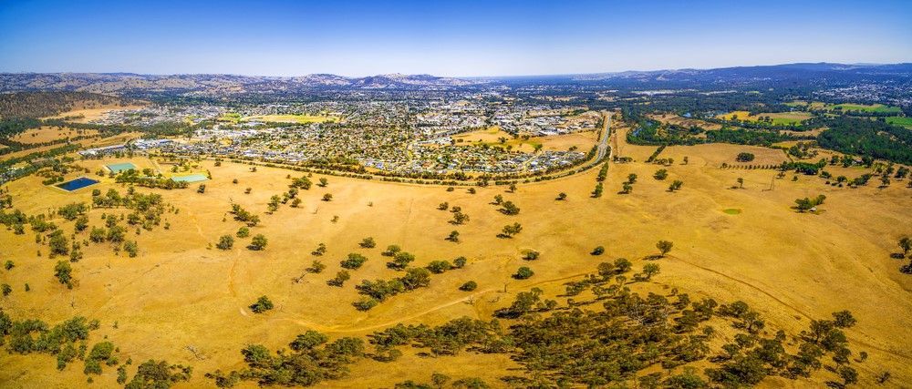 An Aerial View Of A Desert Landscape With A City In The Distance — Twin Cities Glass In Wodonga, NSW