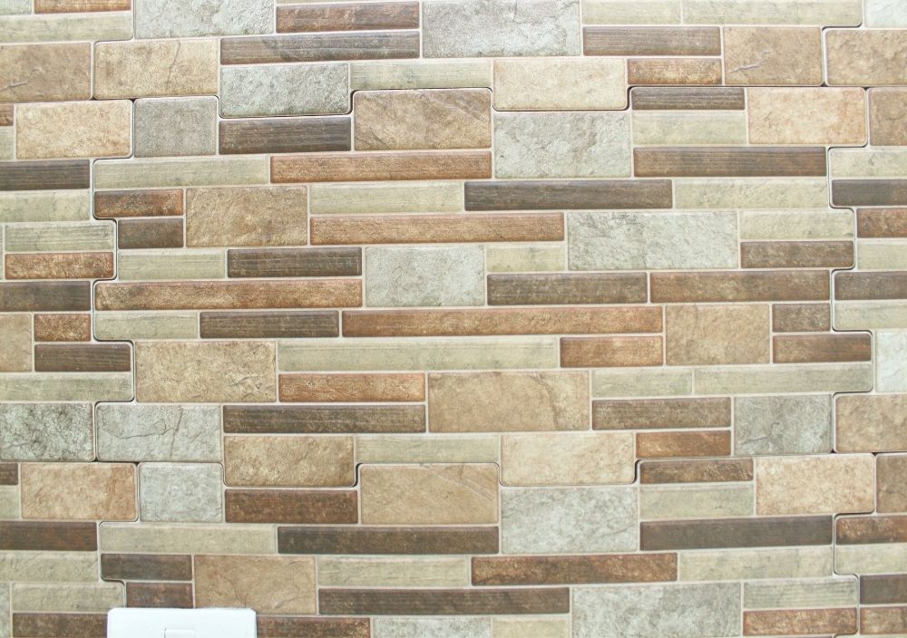 Zest Underfloor Heating Middlesbrough - fitted grey textured tiled feature wall in a living room