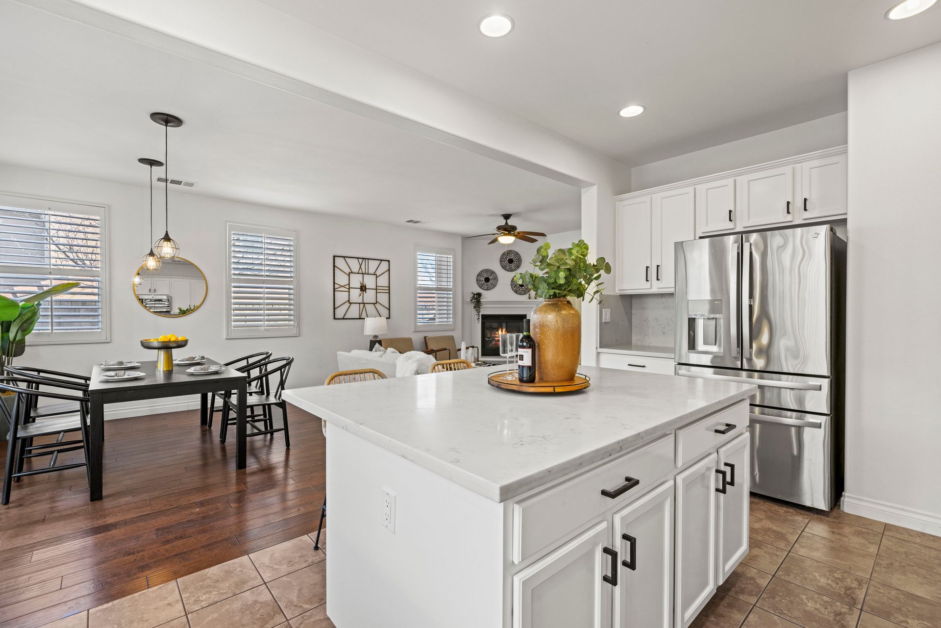 A section of a kitchen that leads to a combined and open dining and living room area.