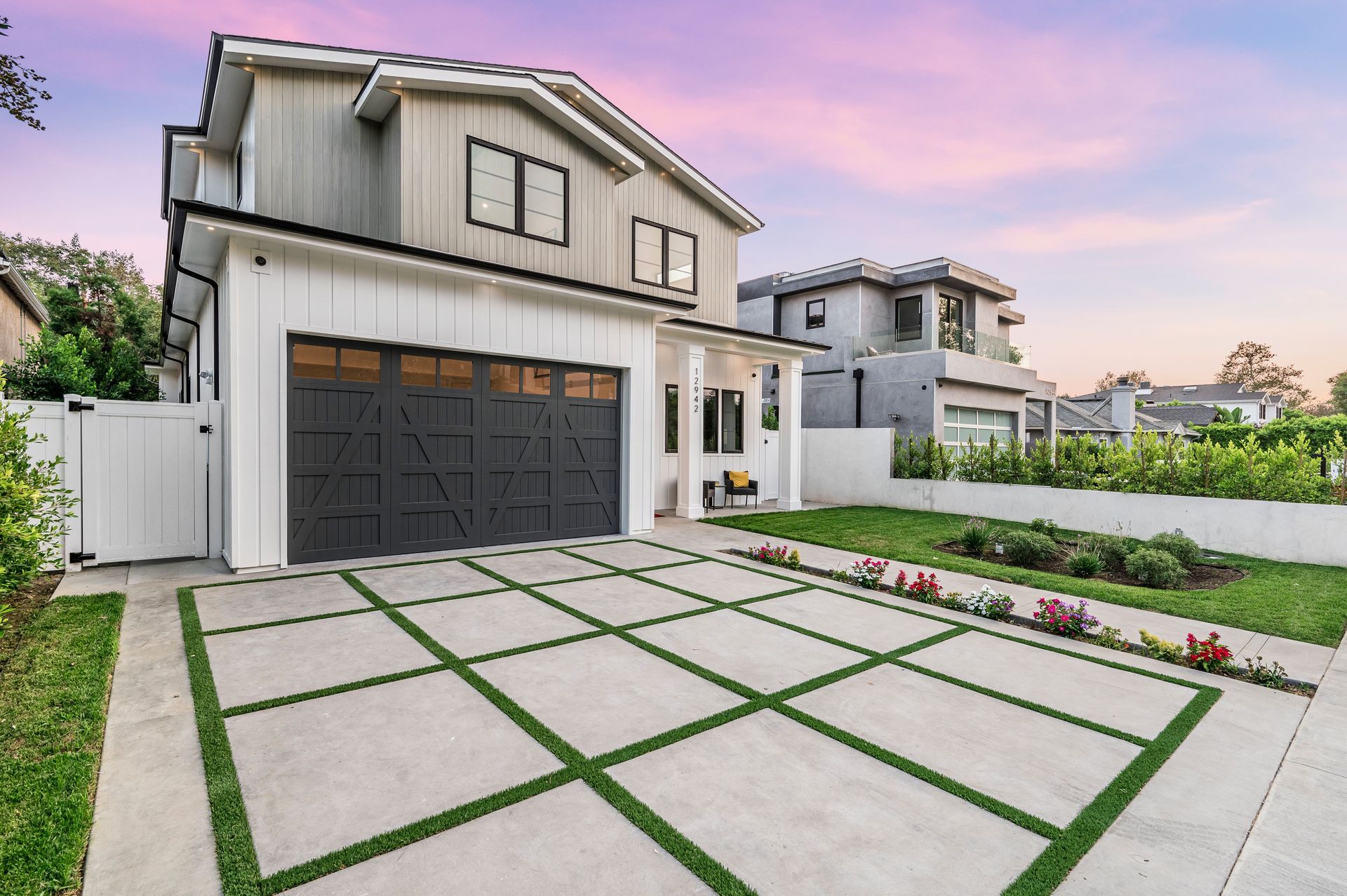 Spacious living room with blue sectional sofa, area rug, wooden floor, and a TV | Homes for Sale in Santa Clarita, CA