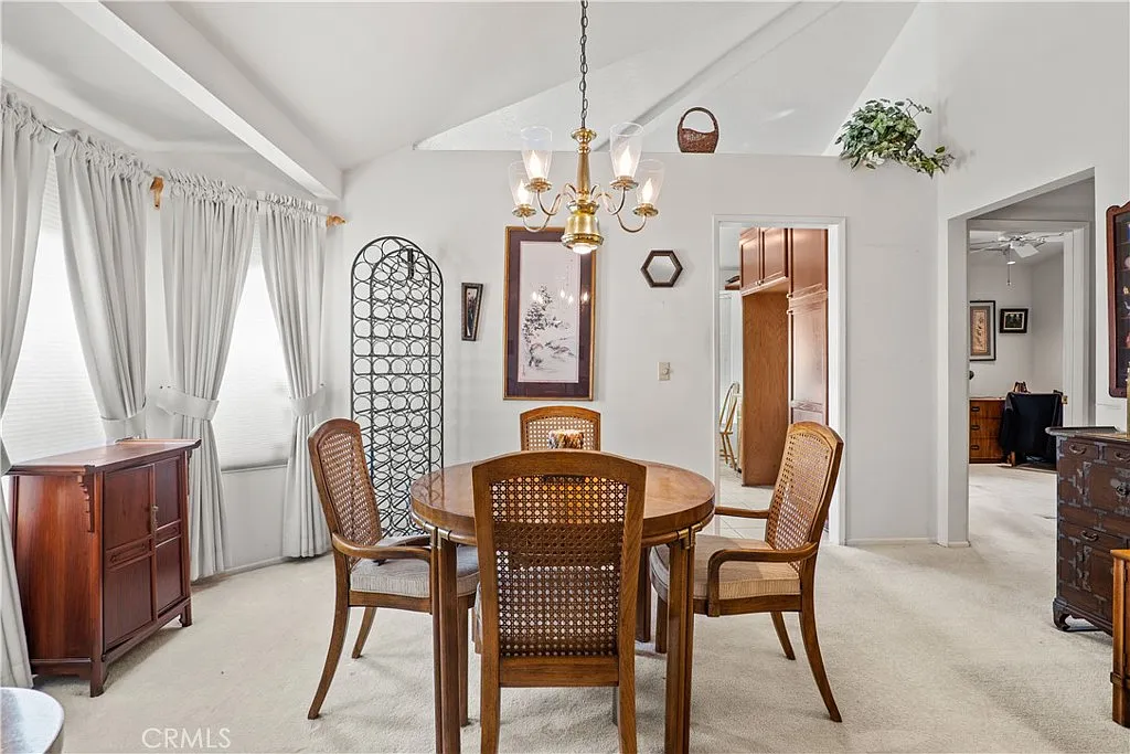 Dining room with round table, cane chairs, and cabinet | Best Realtor in Santa Clarita, CA