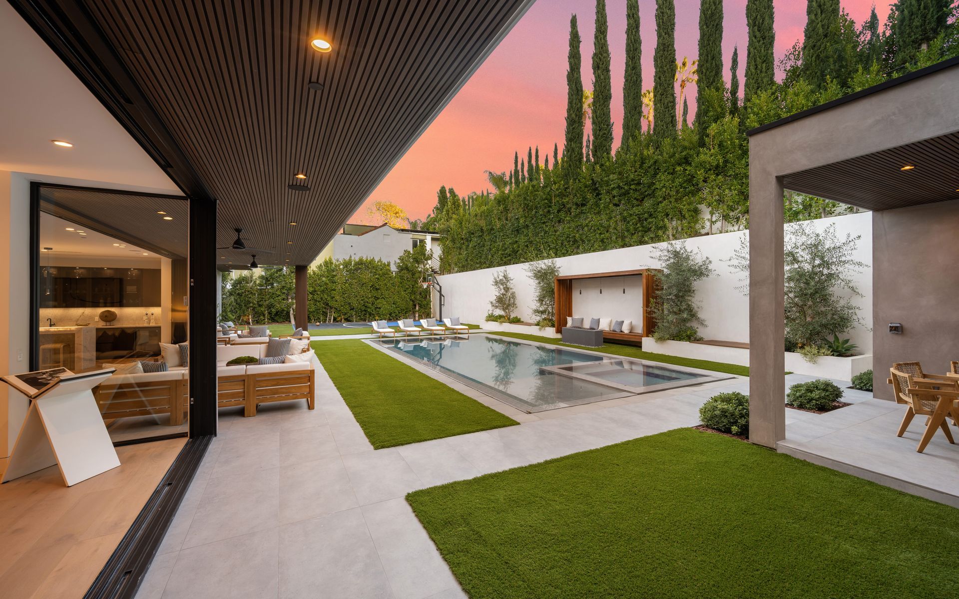 Stone-lined area with wooden posts and a stone wall, surrounded by trees | Homes for Sale in Santa Clarita, CA