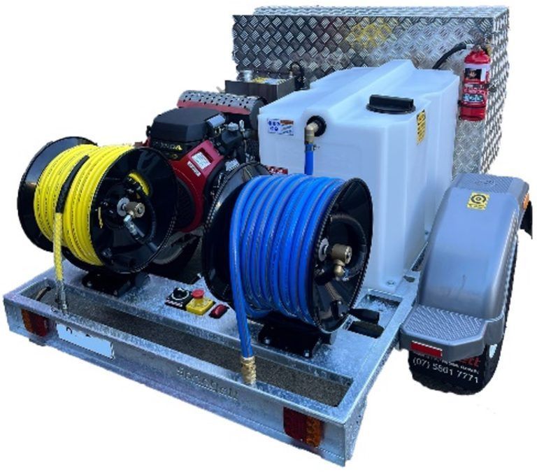 Fire truck pump and hose equipment on a metal trailer, with yellow and blue hoses and water tanks — PlumbPlus in Kawana, QLD
