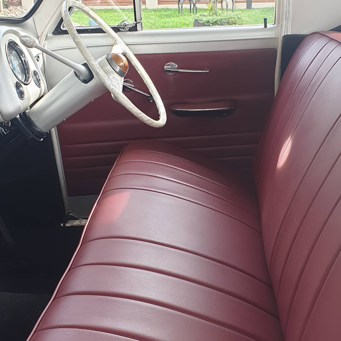 A Car With a Red Seat and a White Steering Wheel — Coastal Coverings In Smithfield, QLD