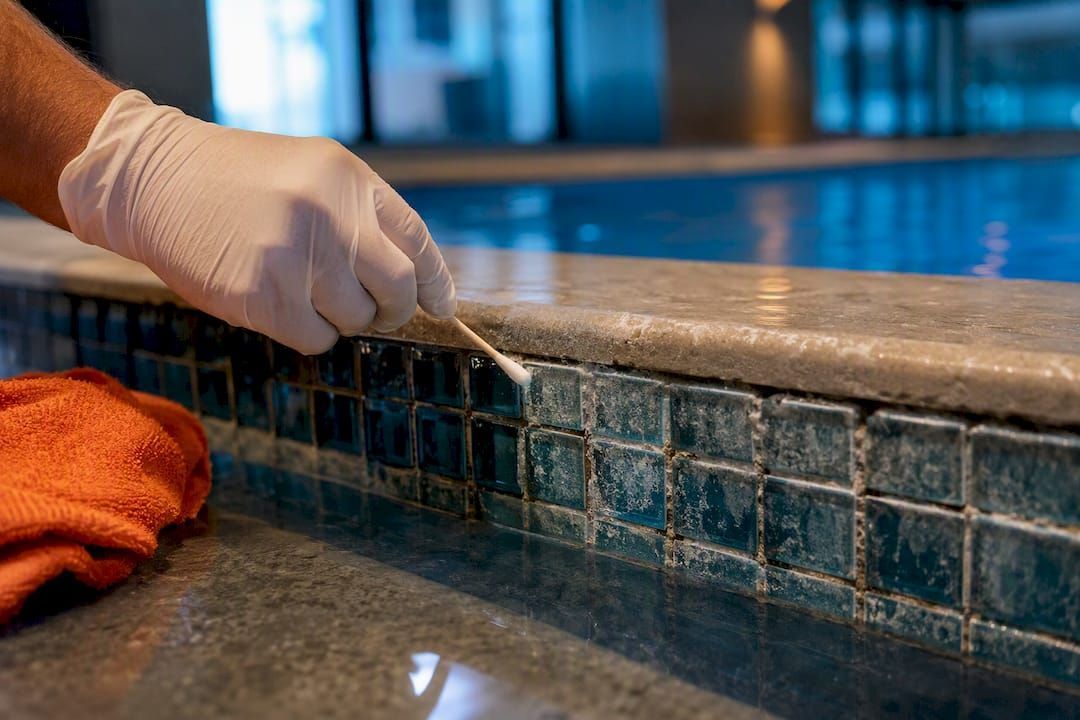 Glass pool tile with calcium scale