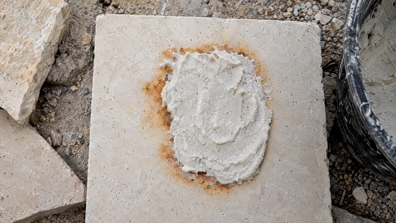 Orange rust marks on concrete pavers