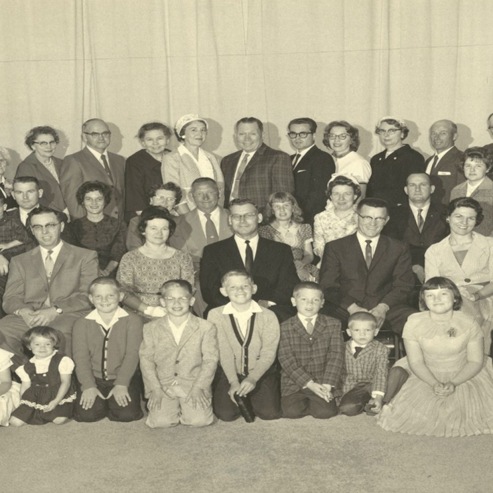 A large group of people are posing for a picture