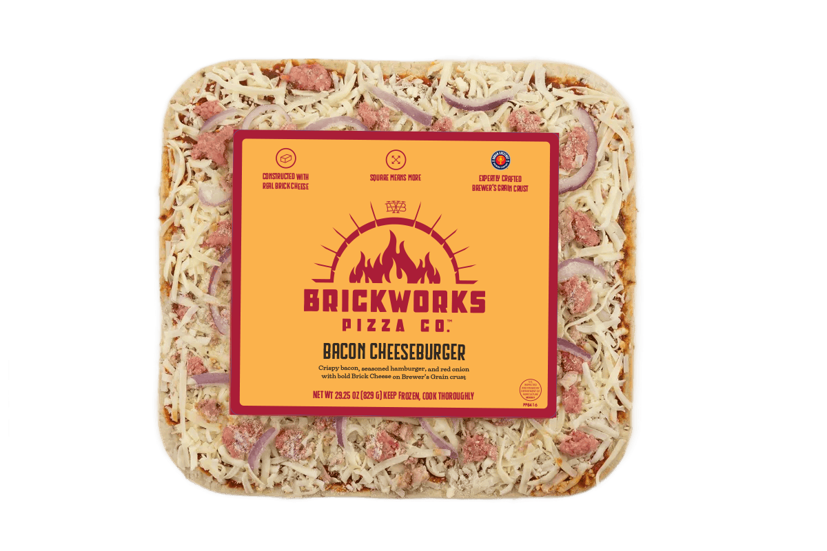 Frozen Brickworks pizza in a clear tray with a bright orange label and shredded cheese topping