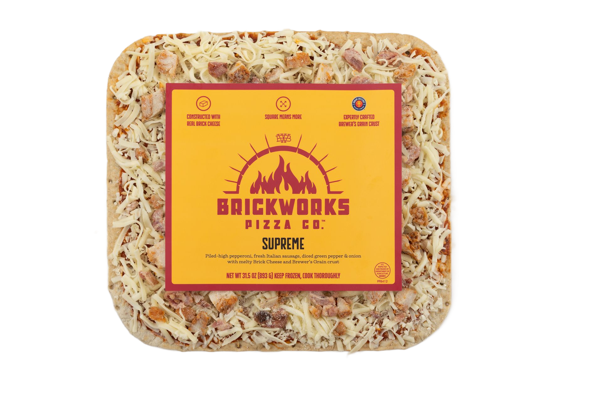 Square clear-pack snack labeled “BRICKWORKS” with orange center on a white background
