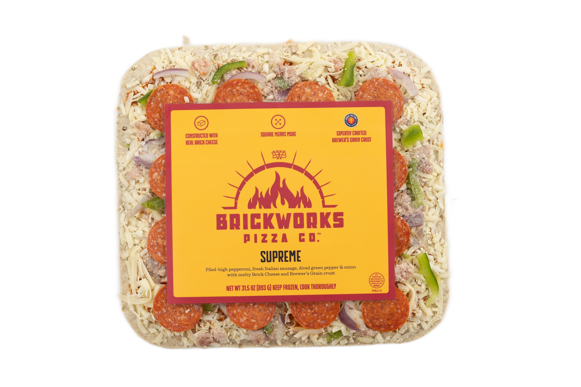 Frozen Brickworks Pizza Co. pizza in clear plastic packaging with an orange label