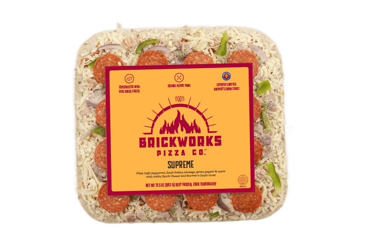 Brickworks Pizza spice seasoning blend in a clear plastic container with orange label