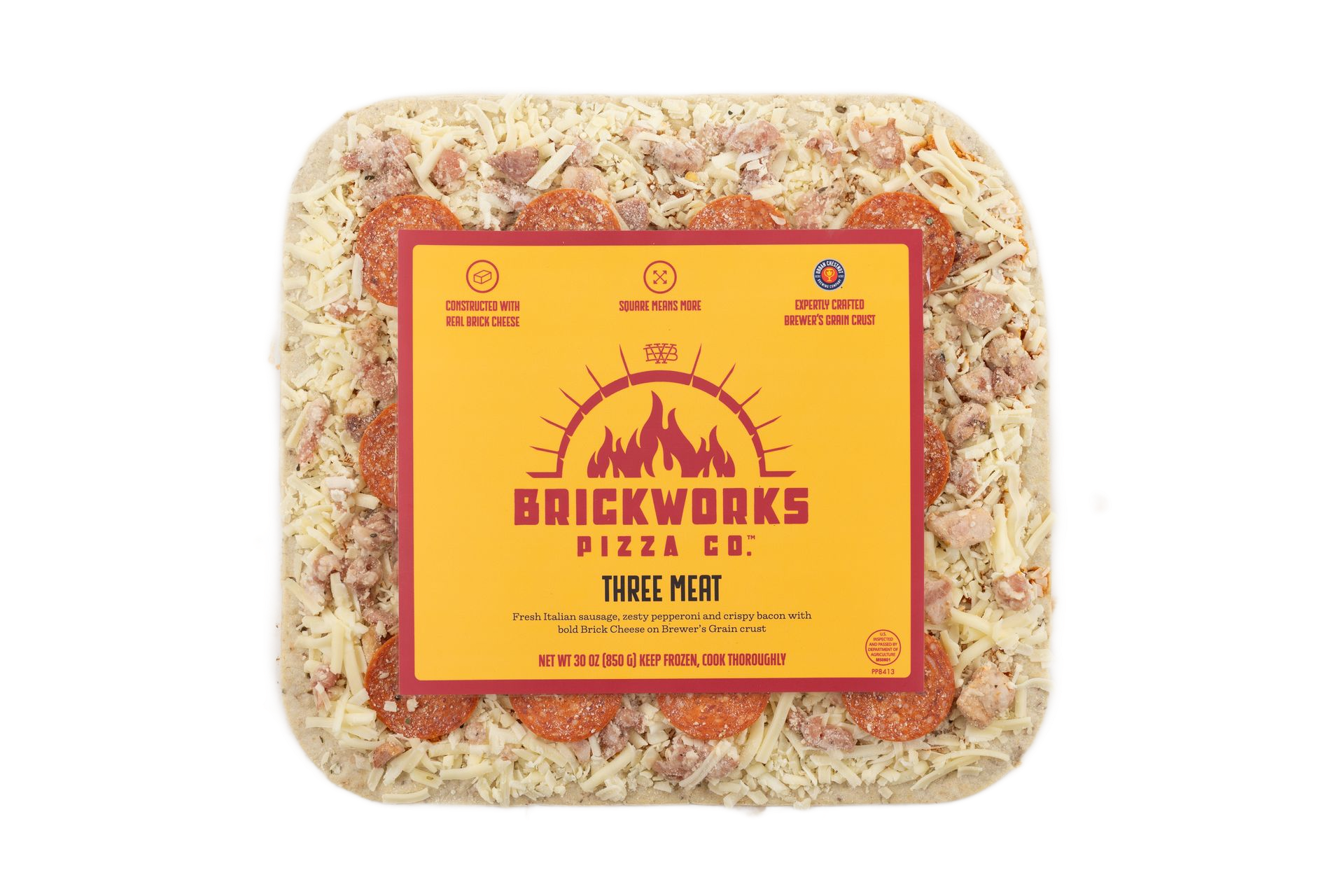 Brickworks Pizza Co. square frozen pizza in clear plastic packaging with yellow label.