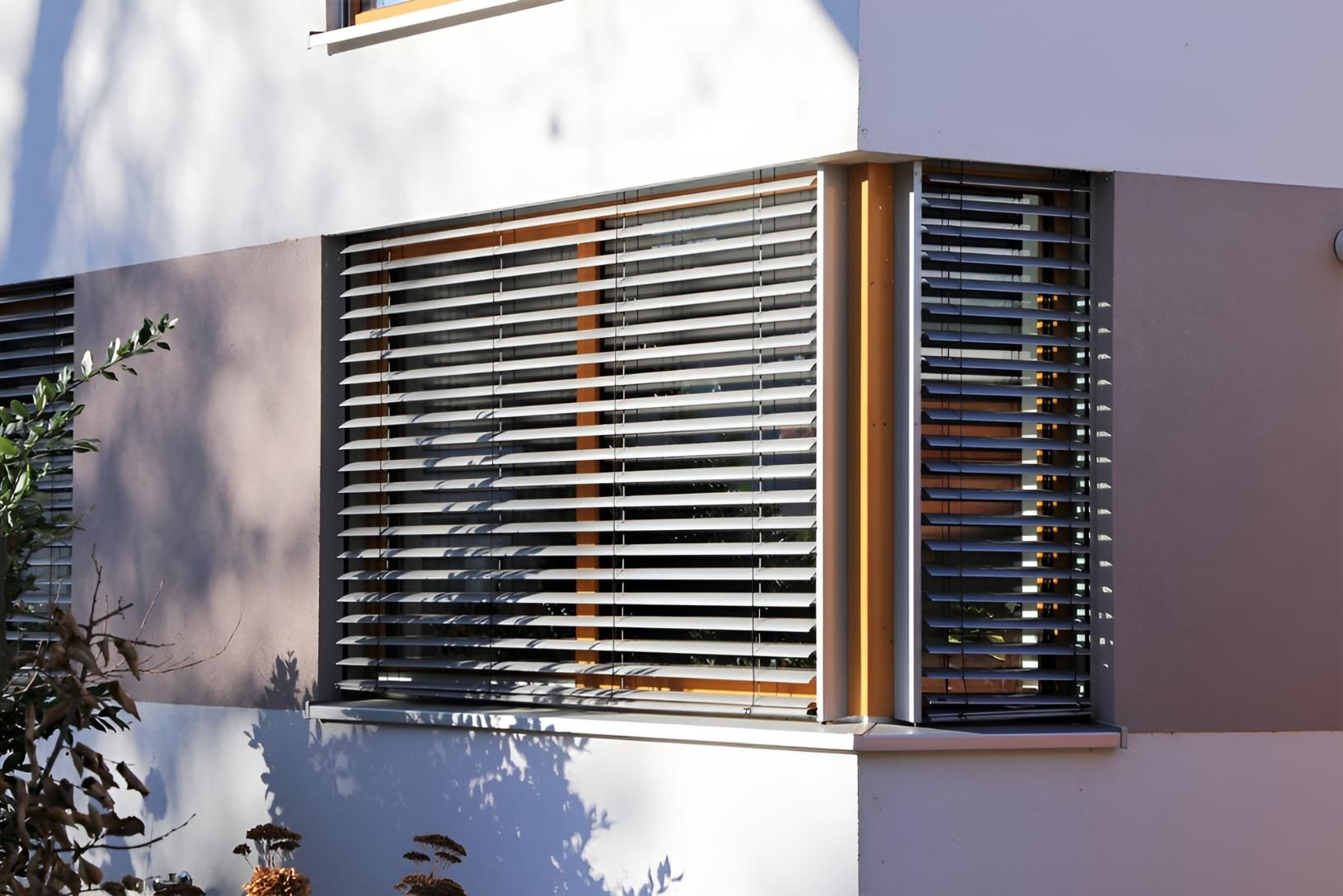 A Building With a Window With Blinds on It — Lismore Curtains & Blinds In Ballina, NSW
