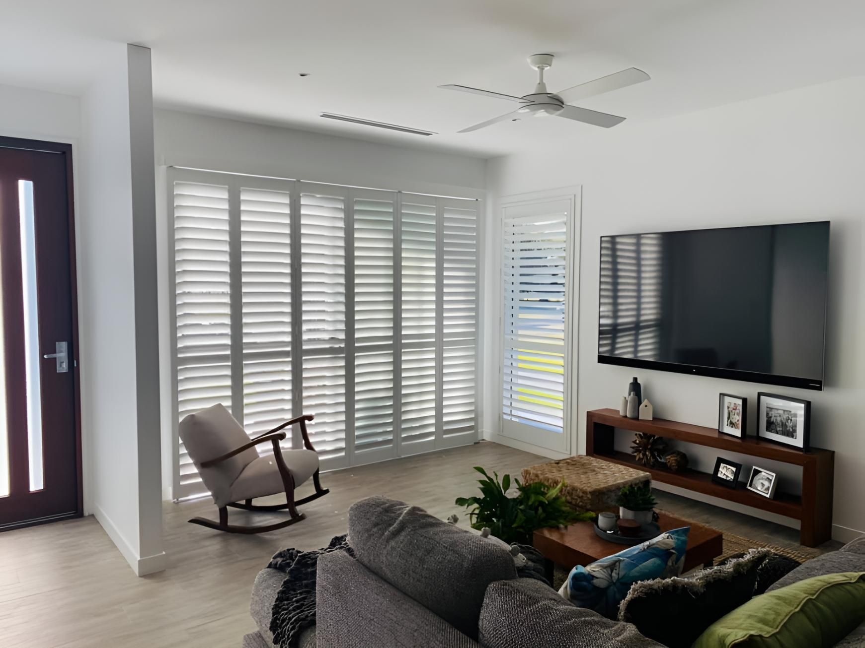A Room With a Couch, Rocking Chair, and Shutters — Lismore Curtains & Blinds In Byron Bay, NSW