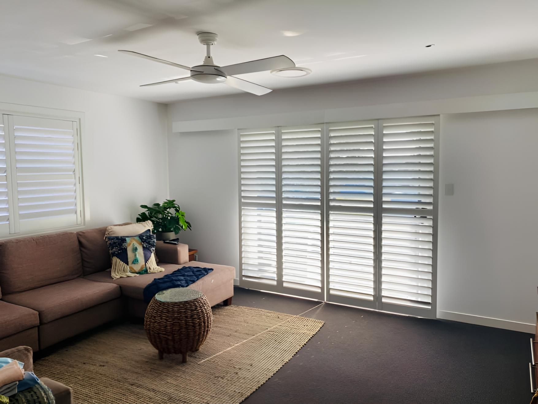 Living Room With a Couch, Ottoman, Table and Ceiling Fan — Lismore Curtains & Blinds In Casino, NSW