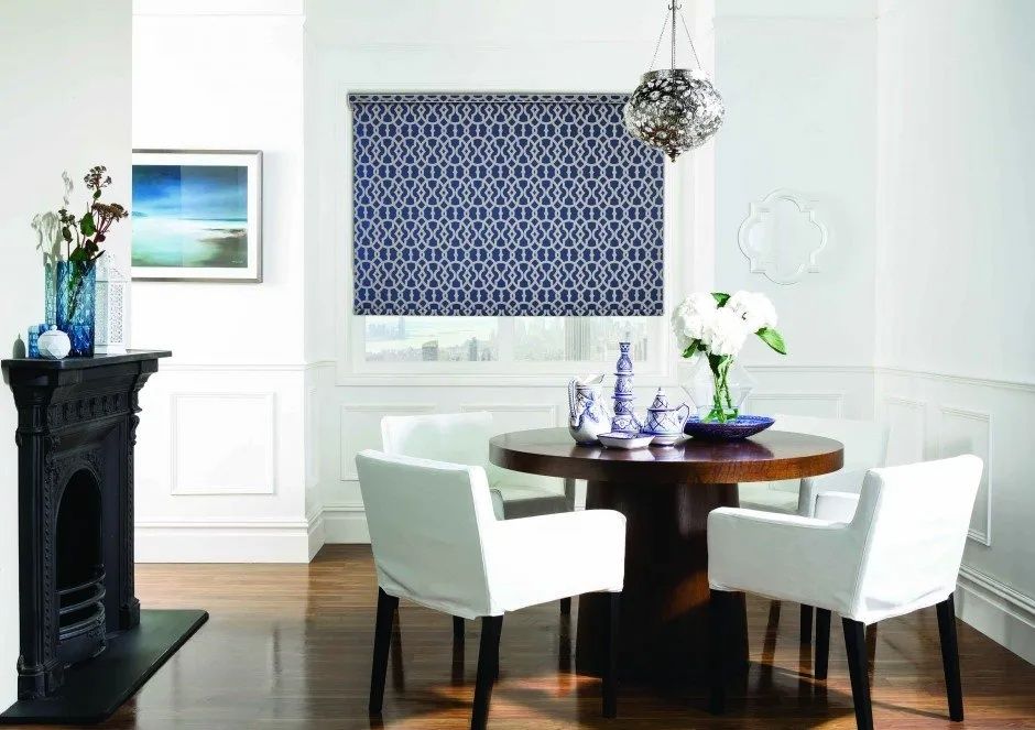 Dining Room With a Round Table and White Chairs and a Fireplace — Lismore Curtains & Blinds In Lismore, NSW