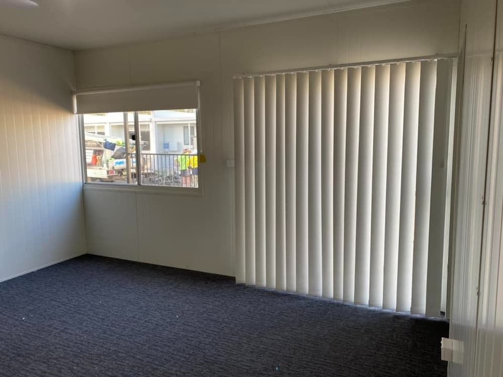 Empty Room With Dark Carpet