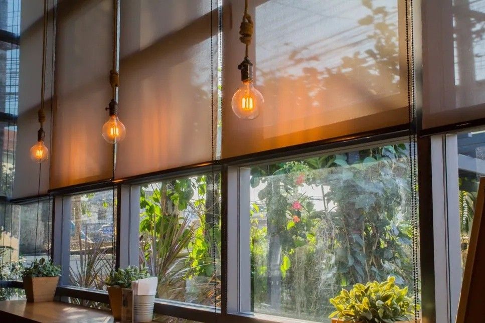 A Restaurant With a Lot of Windows and a Light Bulb — Lismore Curtains & Blinds In Lismore, NSW