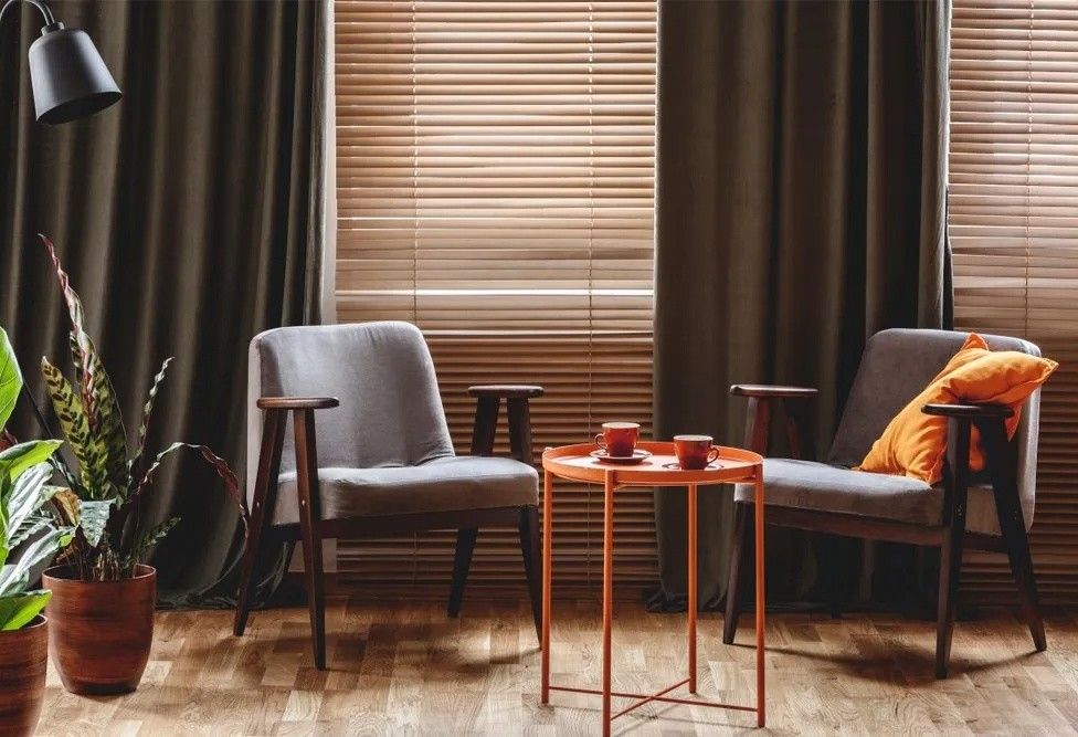 There Are Two Chairs and a Table in the Living Room — Lismore Curtains & Blinds In Lismore, NSW