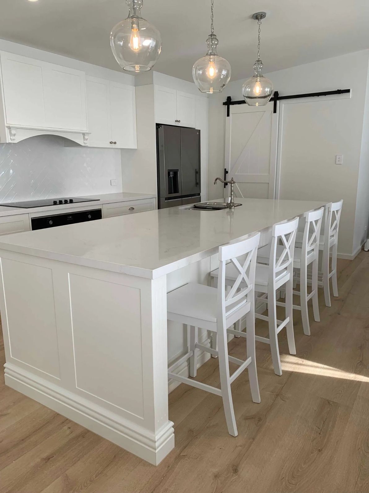 A Kitchen With White Cabinets and Stools — The Kitchen Centre In Tuggerah, NSW
