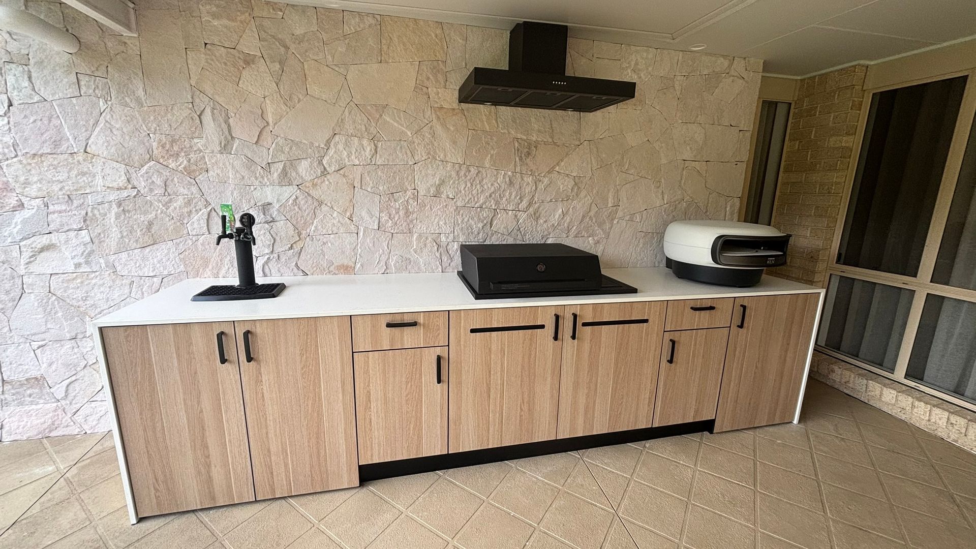 An Outdoor Barbecue with Timber Cabinets — The Kitchen Centre In Tuggerah, NSW