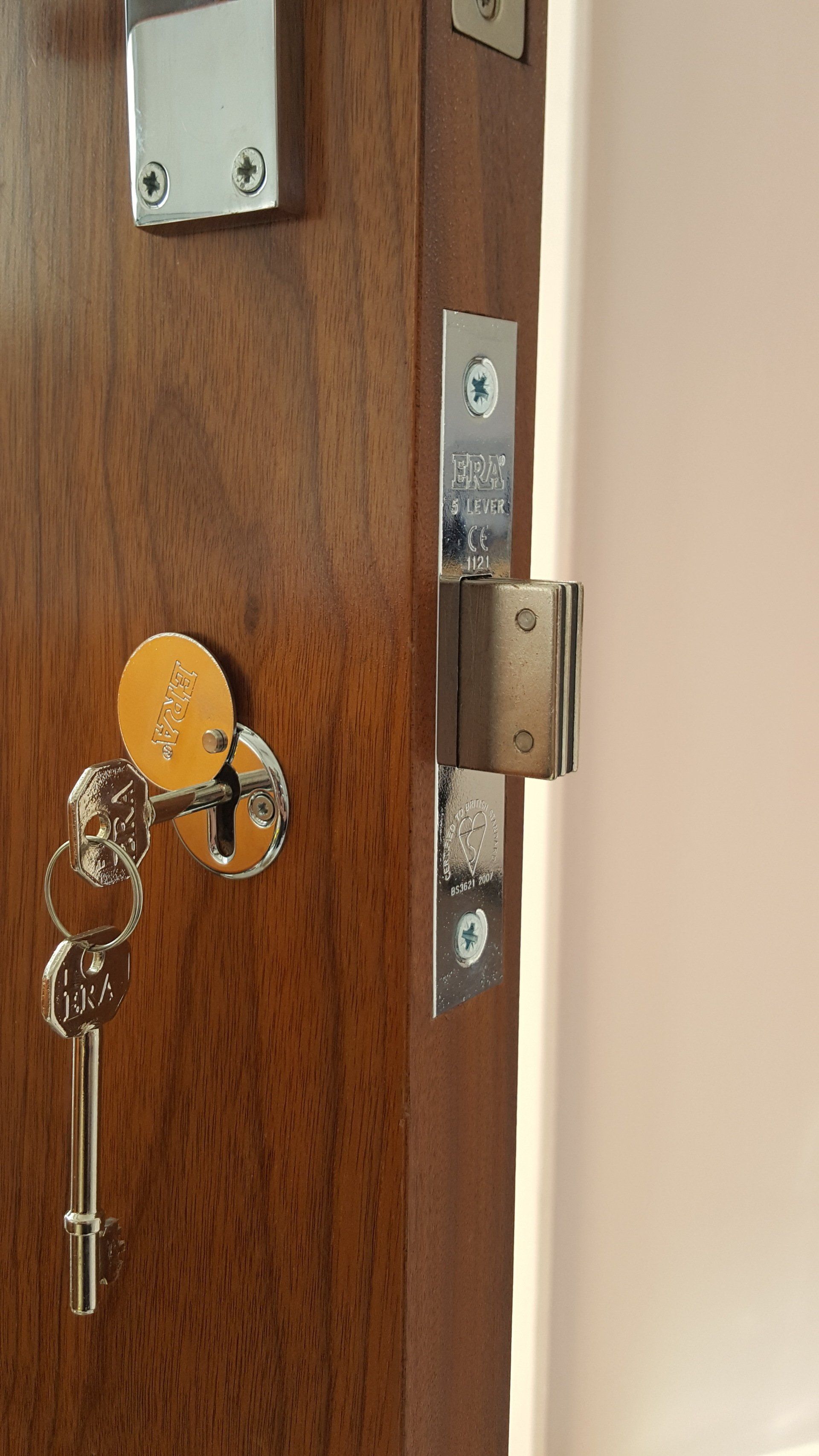 R&R Security locksmith fitting a new door lock in Ealing, London
