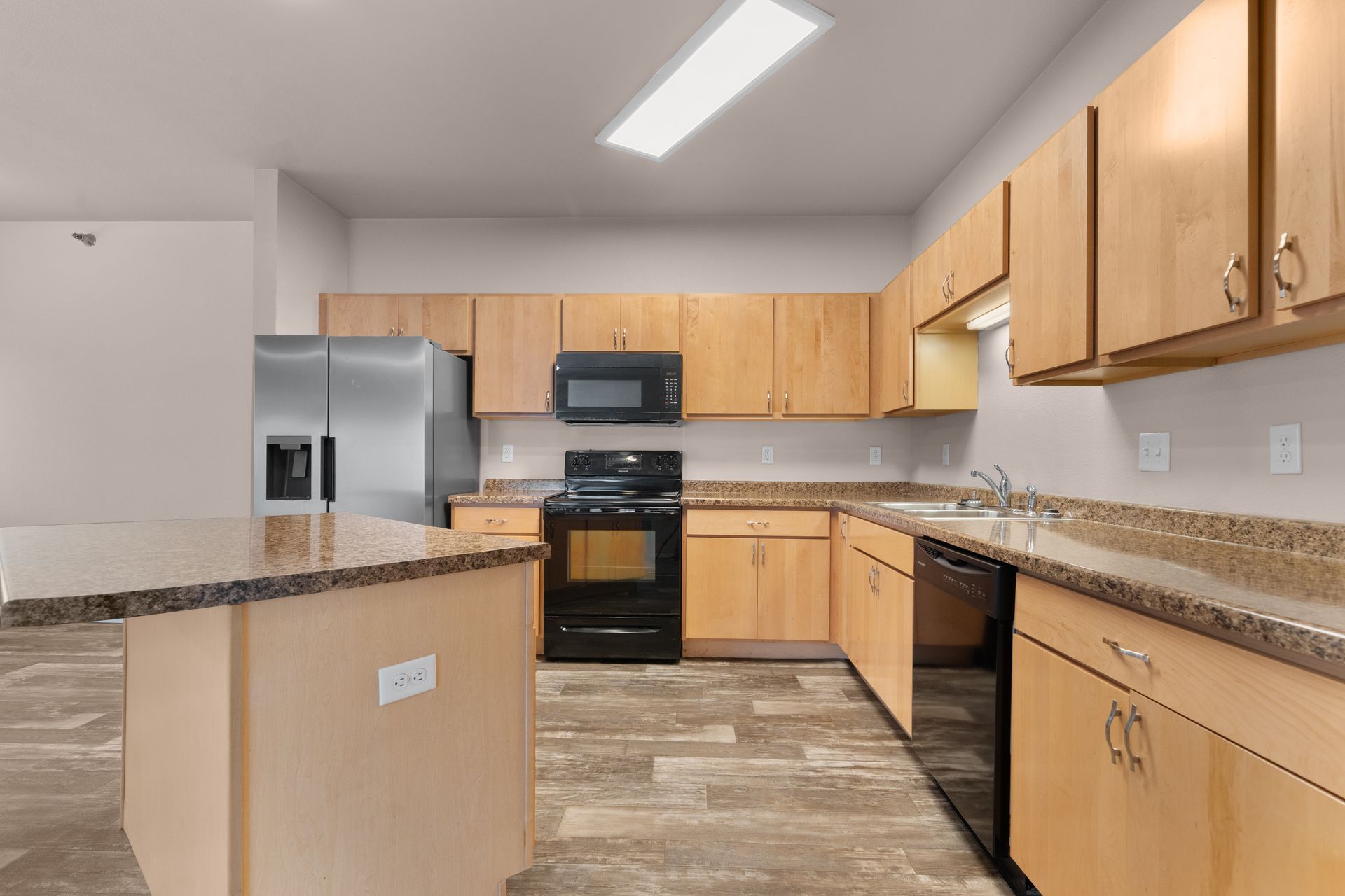 Stonebridge Villas Kitchen with Light Paneled Cabinets