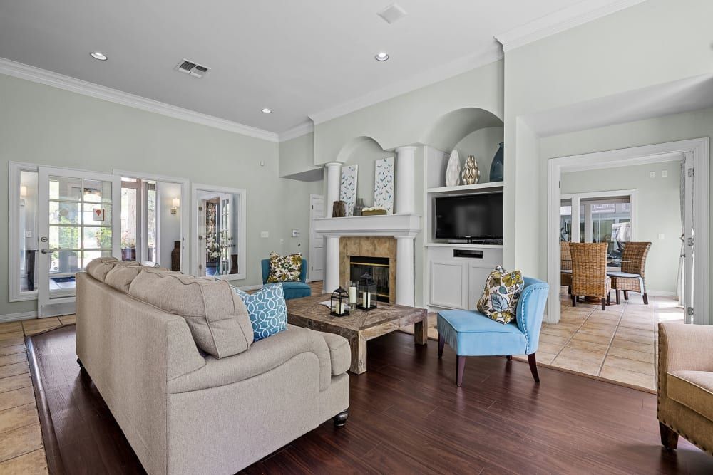 a room filled with furniture and a fireplace at Marquis at Ladera Vista in Austin, TX.