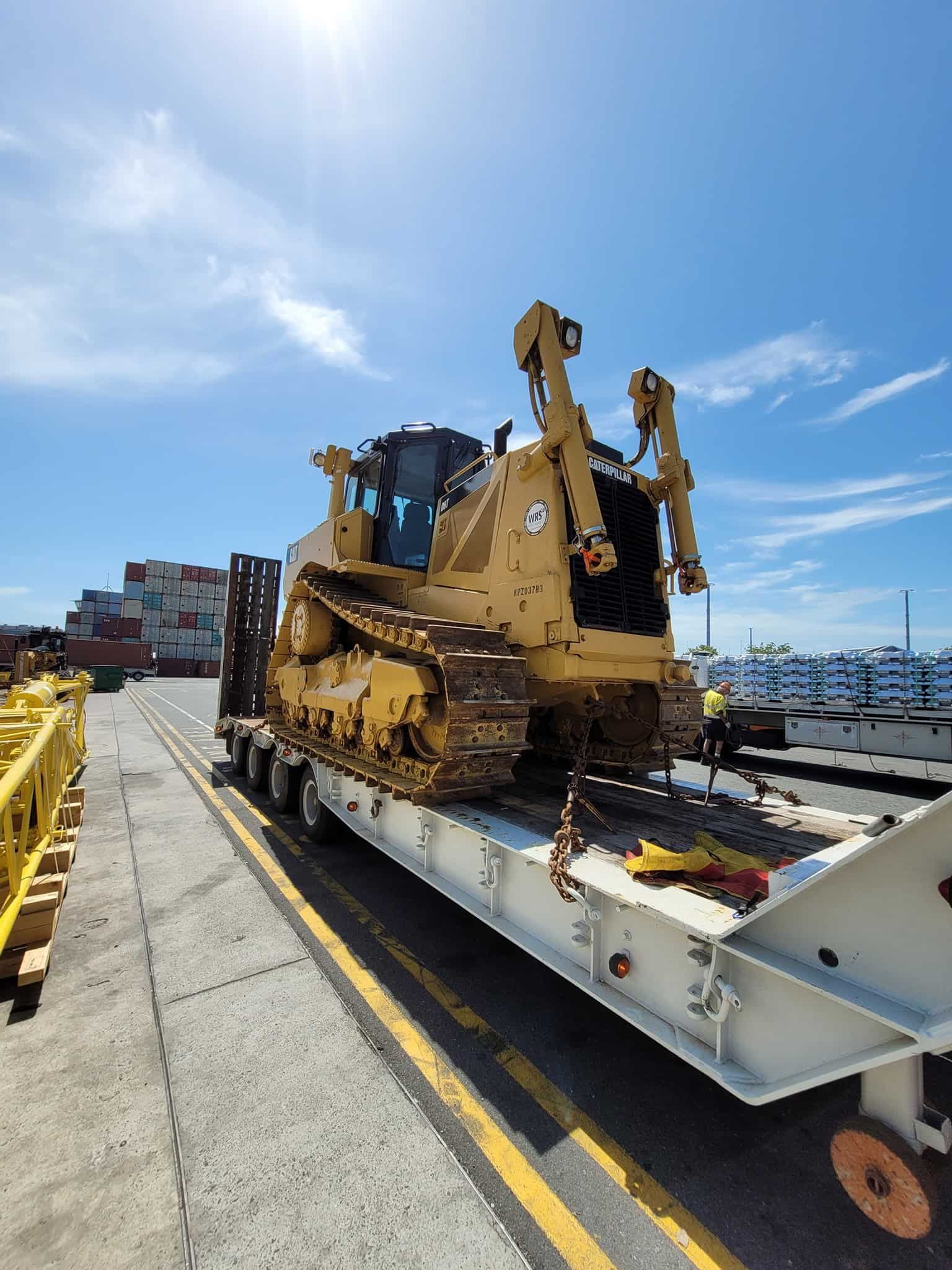 A Bulldozer Is Being Transported On A Trailer — Equiptranz In Kybong, QLD