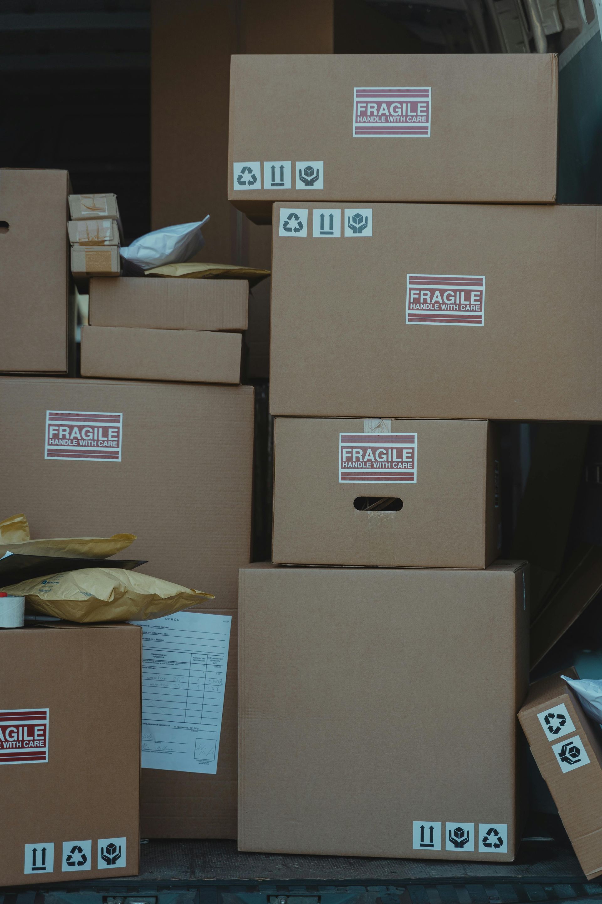 A stack of cardboard boxes with fragile labels on them — Equiptranz In Kybong, QLD
