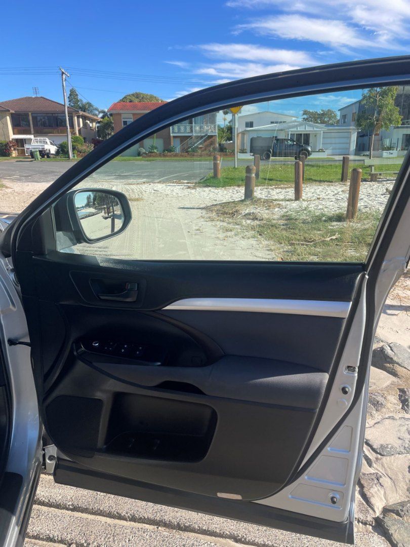 A Car is Parked on the Side of the Road With the Door Open โ Pelican Motors Service Centre In Caloundra West, QLD