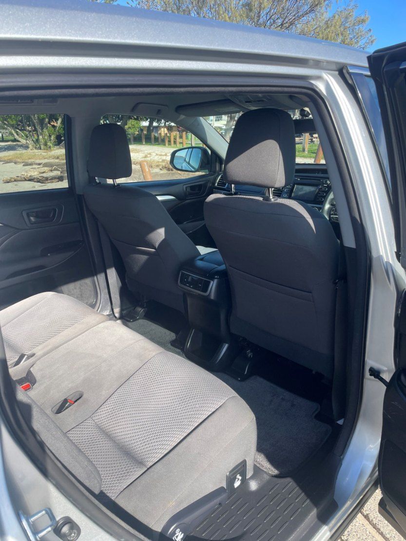 The Back Seat of a Silver Car With the Door Open โ Pelican Motors Service Centre In Caloundra West, QLD